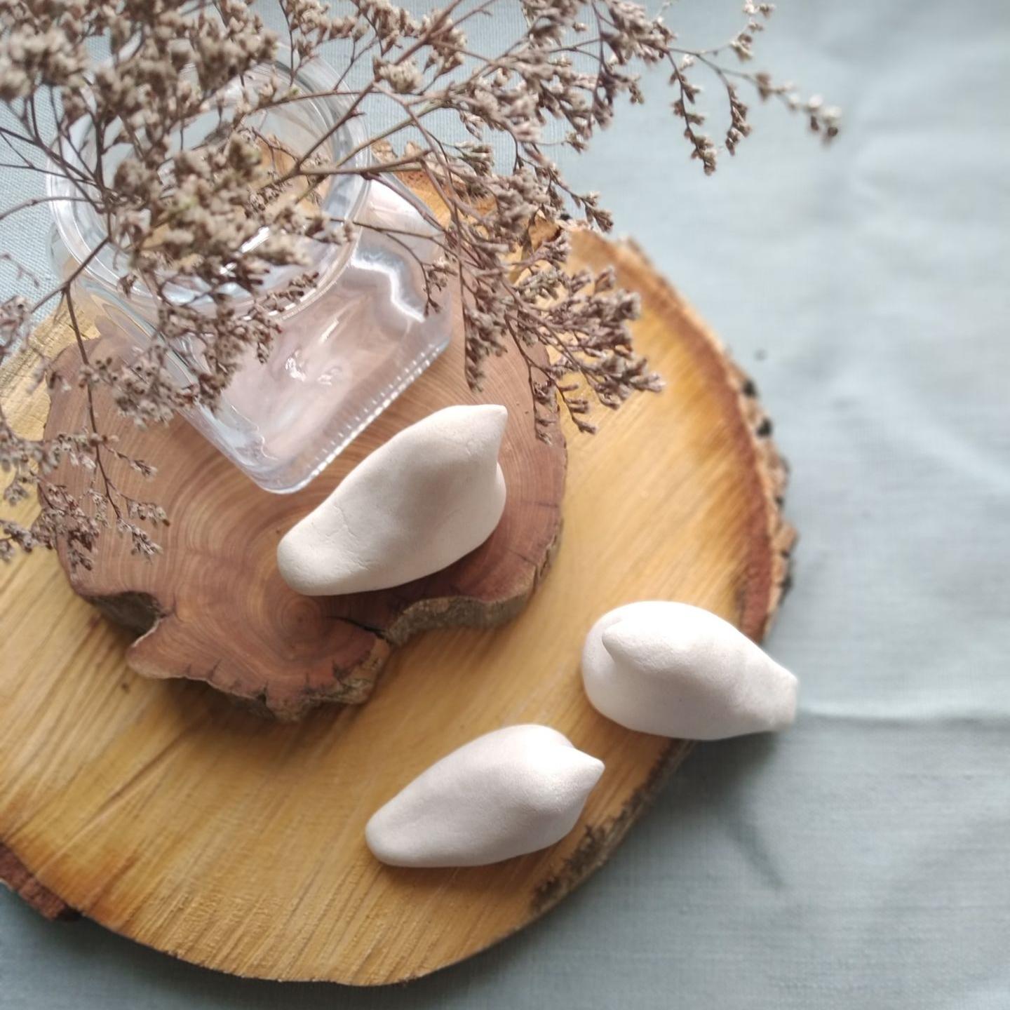 sliced bread with white cream on brown wooden round plate